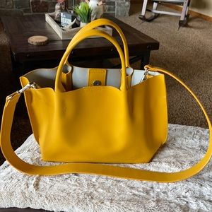 Beautiful mustard yellow bag .